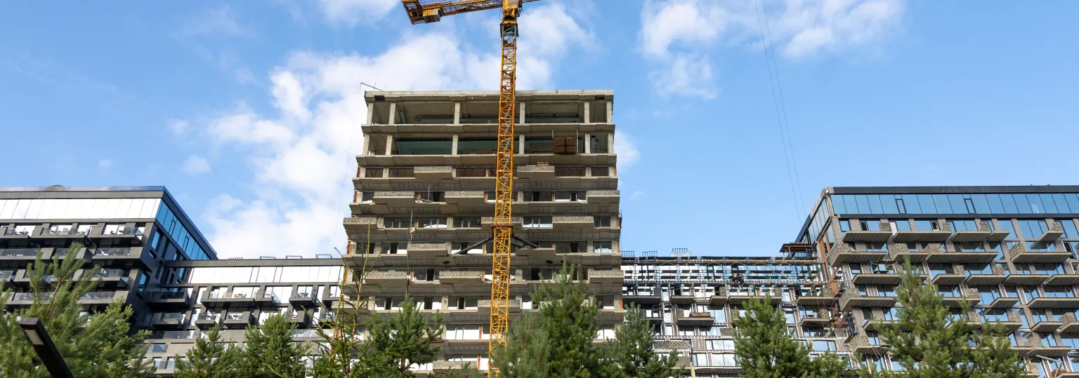 construction-site-with-tower-crane-apartments-urban-modern-architecture.jpg